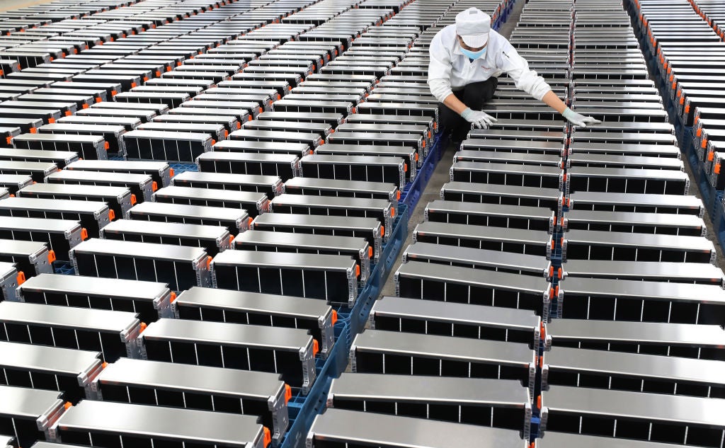 A worker checks parts for the battery packs at a factory of Sunwoda Electric Vehicle Battery in Nanjing in east China's Jiangsu province in March 2021.